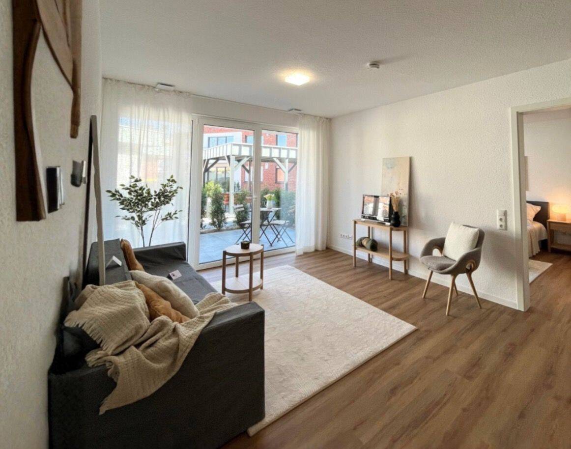 Thumbnail-Erdgeschosswohnung mit beeindruckender Wohnfläche, Terrasse und elegantem Raumzuschnitt.
