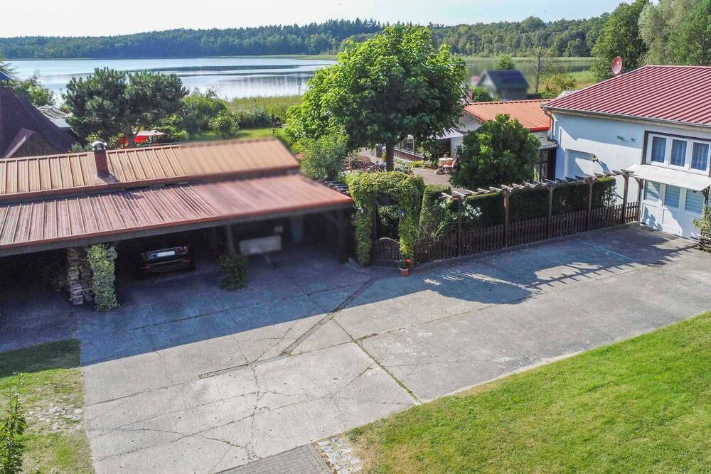 Thumbnail-Direkt am See: Gepflegtes 4-Zi.-Zuhause mit einzigartigem Grundstück, Bootssteg und Einliegerwhg.