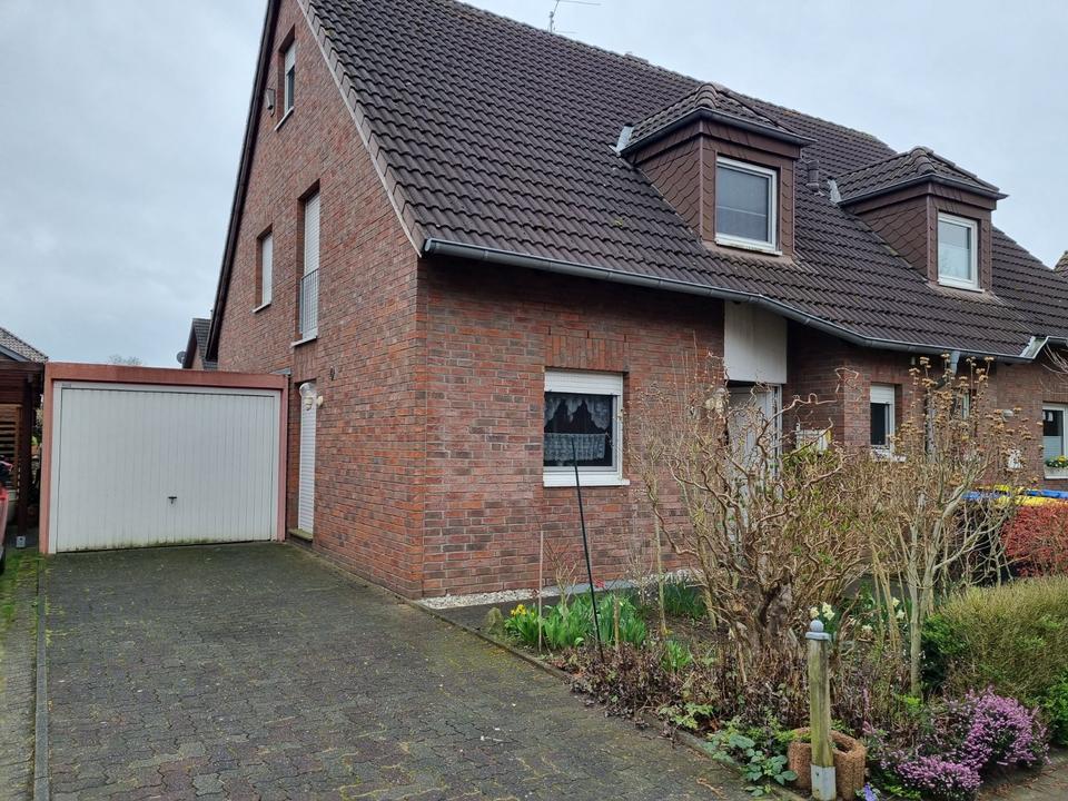 Thumbnail-Doppelhaushälfte mit einer Garage in 46519 Menzelen-Ost